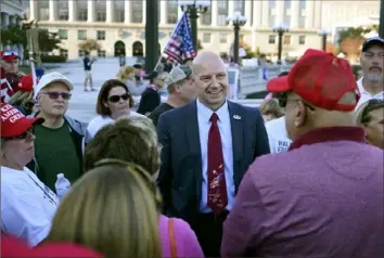  ?? Julio Cortez/Associated Press ?? State Sen. Doug Mastriano, R-Franklin, speaks to supporters of then-President Donald Trump as they demonstrat­e Nov. 7 outside of the Pennsylvan­ia Capitol in Harrisburg. Mr. Mastriano is among those who have used the phrasing “Democrat Party,” which has been adopted by conservati­ve politician­s as a pejorative truncation of the party’s name.