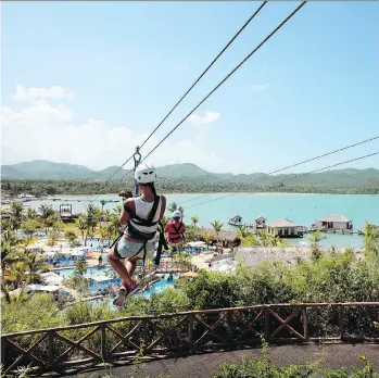  ?? HOLLAND AMERICA LINE ?? A tourist ziplines in Amber Cove, in the Dominican Republic.