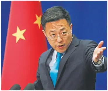  ?? (File Photo/AP/Andy Wong) ?? Chinese Foreign Ministry spokesman Zhao Lijian speaks in February 2020 during a daily briefing at the Ministry of Foreign Affairs office in Beijing. Zhao has repeatedly suggested on Twitter the coronaviru­s might have come from the U.S. Army.