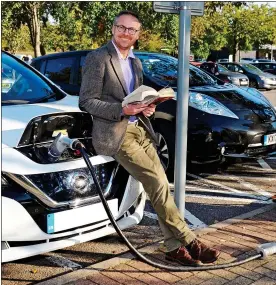  ??  ?? NEW LEAF: Toby Walne waits for his Nissan to charge at an M11 service station