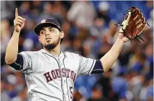  ?? Tom Szczerbows­ki / Getty Images ?? Roberto Osuna earned the save for the Astros after pitching a scoreless ninth inning, allowing one hit against the Blue Jays.