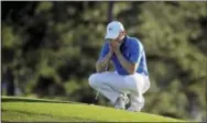  ?? CHRIS CARLSON — THE ASSOCIATED PRESS ?? Jordan Spieth pauses on the 18th green before putting out during the final round of the Masters golf tournament Sunday in Augusta, Ga.