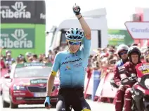  ??  ?? Astana Pro Team’s Colombian cyclist, Miguel Angel Lopez, celebrates as he crosses the finish line winning the 15th stage of the La Vuelta Tour of Spain cycling race on Sunday. (AFP)