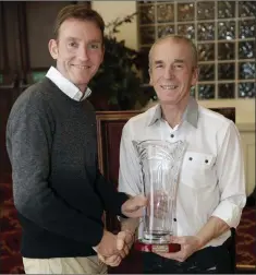  ??  ?? Gary Condon of Bray Runners and Slí Cualann accepts the Athlete of the Year award from Terry Kavanagh.