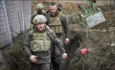  ?? Ukrainian Presidenti­al Press Office via AP ?? Ukrainian President Volodymyr Zelenskyy visits the war-hit Donbas region, eastern Ukraine, on Friday amid an escalation of tensions that has raised fears of a resumption of large-scale hostilitie­s.