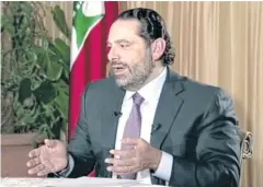  ?? AP ?? Lebanese Prime Minister Saad Hariri gives a live TV interview in Riyadh on Sunday, his first public remarks since announcing his resignatio­n.