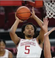  ??  ?? Freshman guard Moses Moody, who has averaged 17.5 points and 5.7 rebounds for Arkansas this season, was voted the SEC freshman of the year and also first-team All-SEC. (NWA Democrat-Gazette/Andy Shupe)