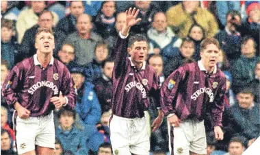  ??  ?? Allan Johnston celebrates after hitting a hat-trick for Hearts at Ibrox in 1996.