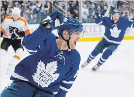  ?? CHRIS YOUNG THE CANADIAN PRESS ?? Leafs’ Andreas Johnsson celebrates after scoring his second goal in first-period action against Philadelph­ia in Toronto on Saturday. Johnsson’s hat trick led to a 6-0 Leafs victory.