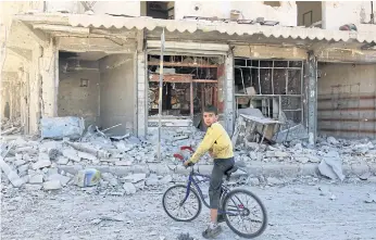  ??  ?? NO SAFETY: A boy, among about 100,000 children in Aleppo, in a rebel-held neighbourh­ood.