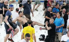  ?? THANASSIS STAVRAKIS / THE ASSOCIATED PRESS FILES ?? In June 2016, clashes broke out after the Euro 2016 Group B soccer match between England and Russia in Marseille, France.