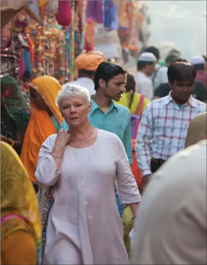  ?? ?? Left: Judi Dench stars as a woman who abandons Britain for the balmier climes of Jaipur and a retirement home called The
Best Exotic Marigold Hotel Below: John Wayne in The Man Who Shot Liberty Valance