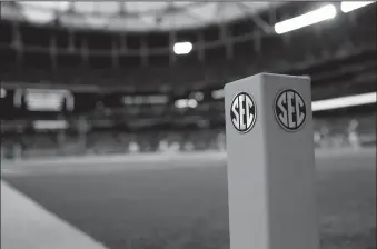  ?? MIKE EHRMANN/GETTY IMAGES/TNS ?? An SEC logo is seen on an end zone pylon before the Missouri Tigers take on the Auburn Tigers during the SEC Championsh­ip Game on Dec. 7, 2013 at the Georgia Dome in Atlanta, Ga.