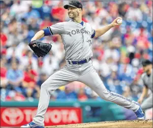 ?? AP PHOTO ?? Toronto Blue Jays starting pitcher J.A. Happ throws during the first inning of a game against the Philadelph­ia Phillies on Sunday in Philadelph­ia.