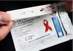  ??  ?? DIY test: HIV self-testing is a way to reach more people with undiagnose­d HIV.