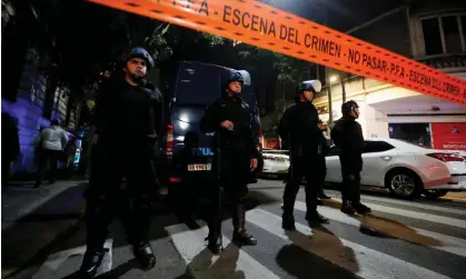  ?? ?? Police officers outside Cristina Fernández de Kirchner’s home in Buenos Aires, Argentina, on 1 September. Photograph: Agustín Marcarian/Reuters