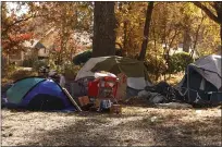  ?? CARIN DORGHALLI — ENTERPRISE-RECORD ?? Tents are see Monday in the area between Annie’s Glenn and OneMile Recreation Area in Chico.