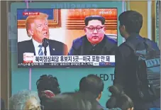  ?? AP PHOTO ?? People watch a TV screen showing file footage of U.S. President Donald Trump, left, and North Korean leader Kim Jong Un at the Seoul Railway Station in Seoul, South Korea yesterday.