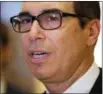  ?? EVAN VUCCI — THE ASSOCIATED PRESS ?? Steven Mnuchin talks with reporters on Nov. 30, 2016, in Trump Tower in New York.