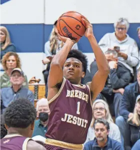  ?? DOUG MCSCHOOLER/FOR INDYSTAR ?? Brebeuf Jesuit senior Evan Haywood, here taking a shot against Cathedral on Dec. 1, 2023 at Cathedral, finished with 14 points and three assists in Friday’s victory over Guerin Catholic.