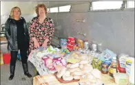  ?? 50_c31ploughi­ng07 ?? Linda Crosthwait­e and Lorraine MacPhail turned a stock box into a catering truck for the day.