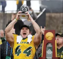  ?? MICHAEL AINSWORTH — THE ASSOCIATED PRESS ?? North Dakota State fullback Hunter Luepke (44) celebrates with his most valuable player award after the FCS Championsh­ip game against Montana State on Saturday in Frisco, Texas.