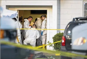  ?? PHOTOS BY JAY JANNER / AMERICAN-STATESMAN ?? Investigat­ors work at the scene of the mass shooting at First Baptist Church in Sutherland Springs in November. The attack left 26 dead; about 20 others were wounded.