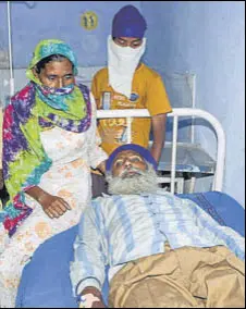  ?? AFP ?? A man who consumed spurious liquor undergoing treatment at a hospital in Tarn Taran district on Sunday.