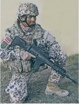  ??  ?? 身穿迷彩服的拉脱维亚­陆军士兵