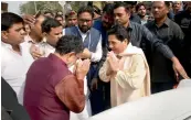  ?? — PTI ?? BSP president Mayawati and Samajwadi Party leader Ram Govind Chaudhary exchange greetings in Lucknow on Wednesday.