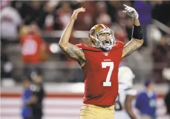  ?? Carlos Avila Gonzalez / The Chronicle 2014 ?? Colin Kaepernick reacts after his 90-yard TD run in ’14. He could do that for the Raiders in ’18.