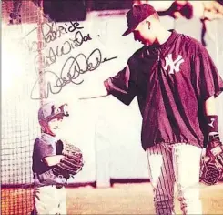  ?? Courtesy of Pat Mahomes ?? YANKEES GREAT Derek Jeter autographe­d this photograph and gave it to a young Mahomes. “He grew up in the clubhouse,” his father, Pat, said.