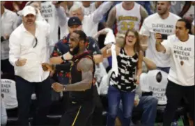  ?? RON SCHWANE — THE ASSOCIATED PRESS ?? LeBron James reacts after making a 3-point shot during the second half of Game 6 of the Eastern Conference finals against the Celtics on May 25.