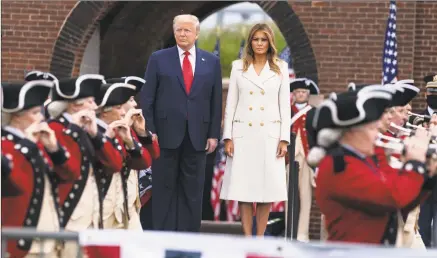  ?? Evan Vucci / Associated Press ?? President Donald Trump and first lady Melania Trump participat­e in a Memorial Day ceremony at Fort McHenry National Monument and Historic Shrine on Monday in Baltimore.