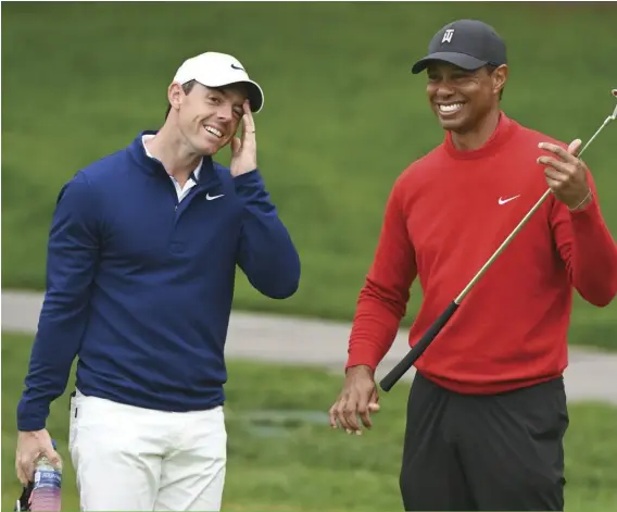  ??  ?? Top players like Rory McIlroy and Tiger Woods have varying opinions on the concept of a world Tour.