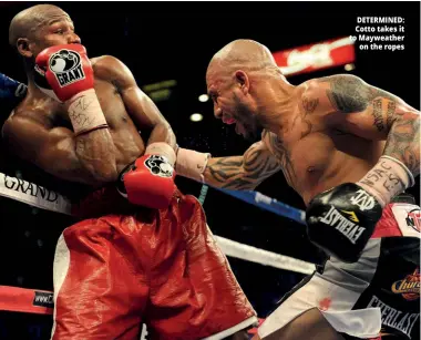  ??  ?? DETERMINED: Cotto takes it to Mayweather on the ropes