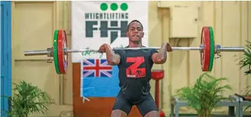  ?? Photo: Leon Lord ?? Weightlift­er Apakuki Tabuwaiwai makes his lift in the 61 kilogramme category in Suva on May 21, 2022.