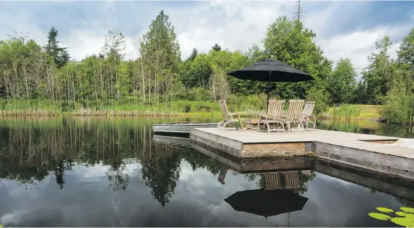  ?? PHOTOS: DEBRA BRASH ?? The large lakeside dock is a favourite relaxing area and play platform for the owners’ four grandchild­ren, who love the property.