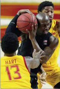  ??  ?? Michigan State’s Joshua Langford, center, drives to the basket against Maryland’s Hakim Hart, left, and Aaron Wiggins during the Spartans’ 73-55loss Sunday, which ended a three-game winning streak. Michigan State is 13-10, 7-10in the Big Ten.