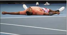  ?? LEE JIN-MAN — THE ASSOCIATED PRESS ?? Australia’s Nick Kyrgios lies on the court after defeating Russia’s Karen Khachanov in their third round singles match at the Australian Open tennis championsh­ip in Melbourne on Saturday.