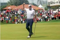  ?? AFP ?? Marc Leishman celebrates after winning the 2018 CIMB Classic. —