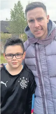  ??  ?? Helping out Barrie McKay sponsored 11-year-old Cooper Black when they met at Somervell