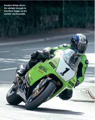  ??  ?? Braddan Bridge allows the sunlight through to find Horst Saiger on the number one Kawasaki.