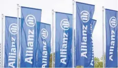  ??  ?? Allianz flags wave at its headquarte­rs in Berlin, Germany. — Reuters