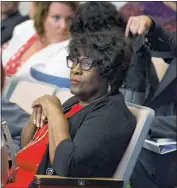  ??  ?? Del. Edith Patterson (D-Charles) pauses for a moment’s reflection amid the bustle of Tuesday evening’s public hearing on legislativ­e proposals.