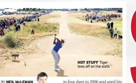  ??  ?? HOT STUFF Tiger tees off on the sixth