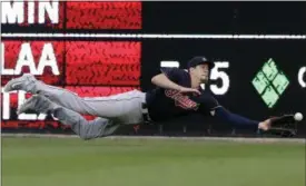  ?? CARLOS OSORIO — THE ASSOCIATED PRESS ?? Indians center fielder Bradley Zimmer dives for but is unable to catch a double hit by the Tigers’ Bryan Holiday during the third inning. Zimmer was injured on the play and had to leave the game.