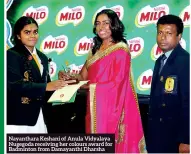  ??  ?? Nayanthara Keshani of Anula Vidyalaya Nugegoda receiving her colours award for Badminton from Damayanthi Dharsha