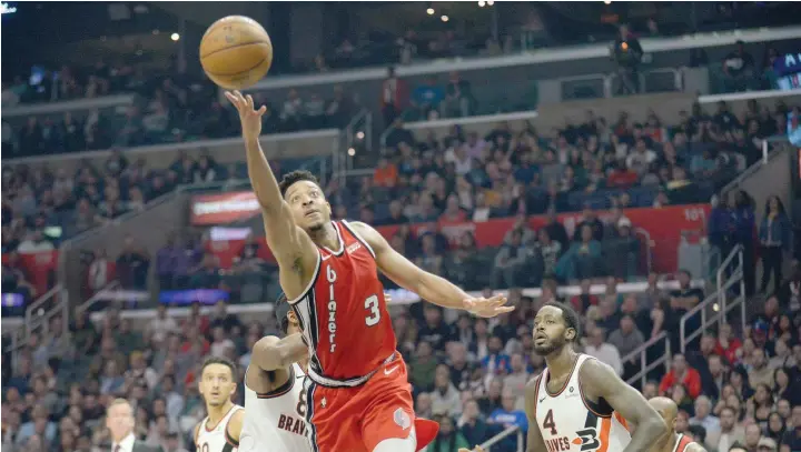  ?? — USA Today Sports ?? Portland Trail Blazers guard CJ Mccollum (3) shoots ahead of Los Angeles Clippers forward Maurice Harkless (8) and forward Jamychal Green (4) during the second half at Staples Center.