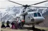  ?? —PTI ?? An IAF helicopter evacuates stranded people at Kyenjin Gompa makeshift helipad on Tuesday